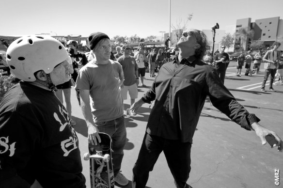 Dave Hackett giving pointers  to Steve Caballero.